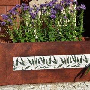 Flowers in hardwood planter