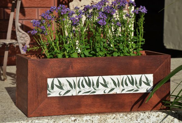 Flowers in hardwood planter